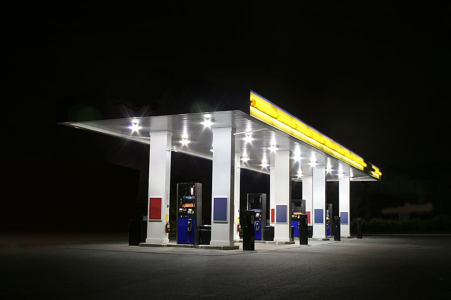 white and yellow gas station, night time, illuminated, refueling HD wallpaper