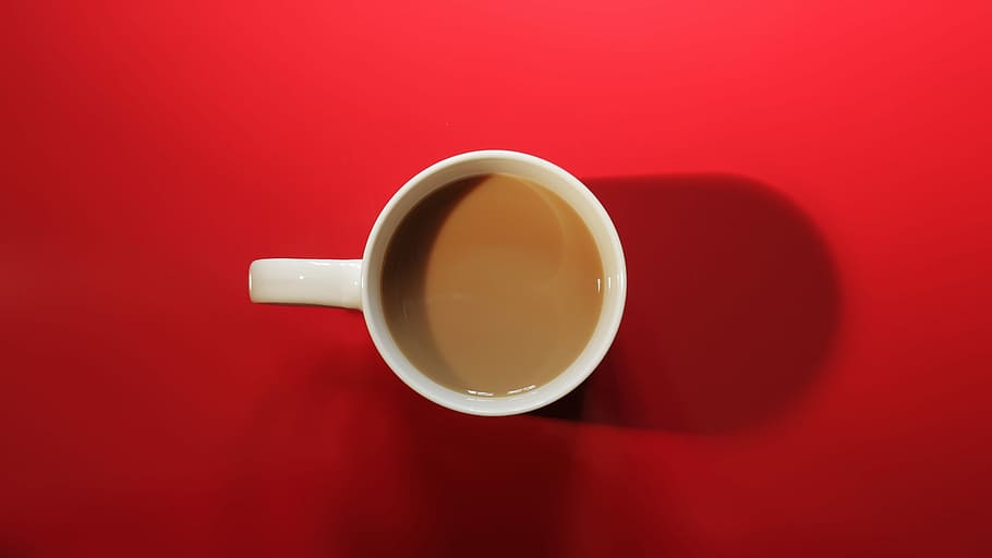 above angle photo of white ceramic mug with brown coffee in it HD wallpaper