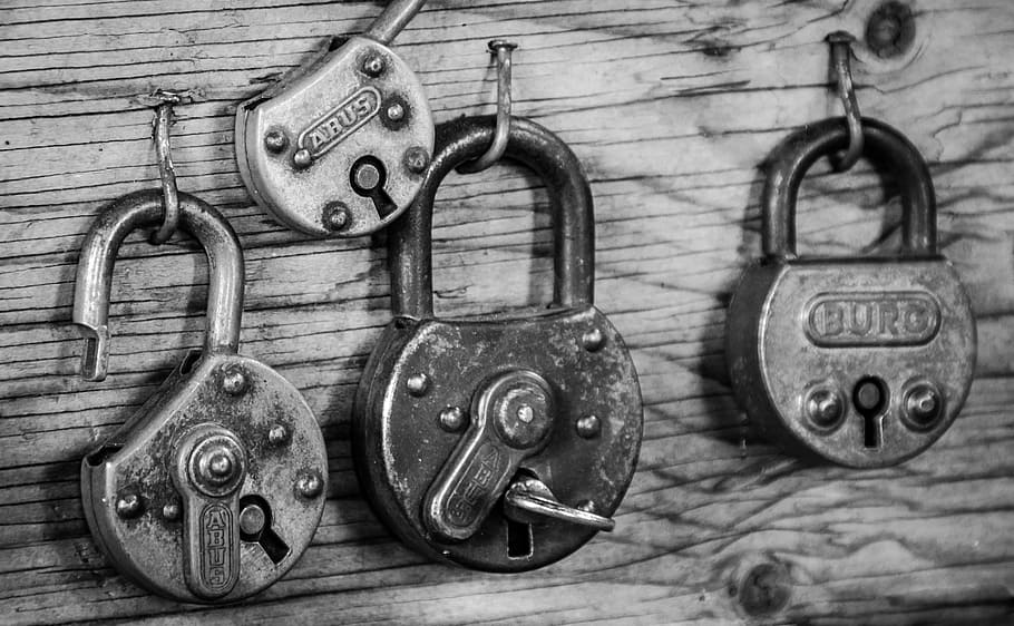grayscale photo of padlocks, rusted, barn, shed, iron, vintage