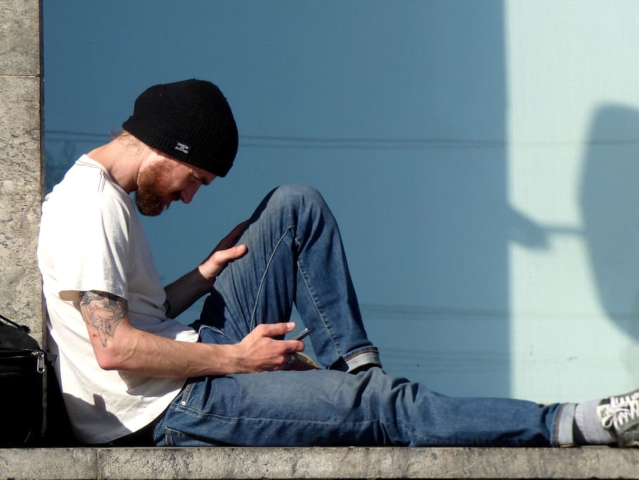 man, reading, mobile, phone, hat, black, beard, young, sitting HD wallpaper