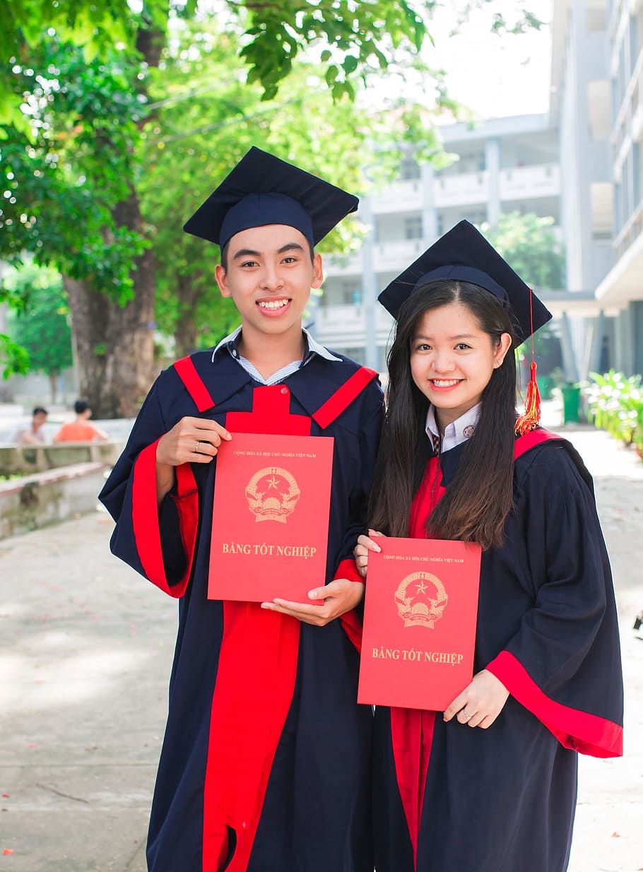 man and woman wearing academic suits, friend, student, graduate