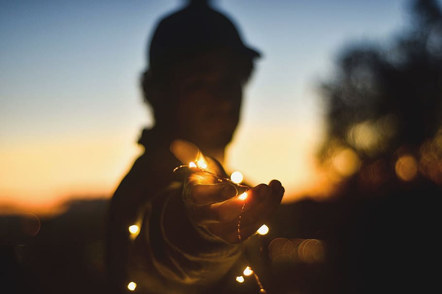 person holding string lights at nightitme, untitled, white sky HD wallpaper