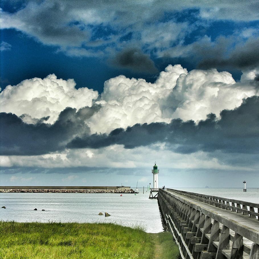 photo of gray concrete sea dock during cloudy day, lighthouse HD wallpaper