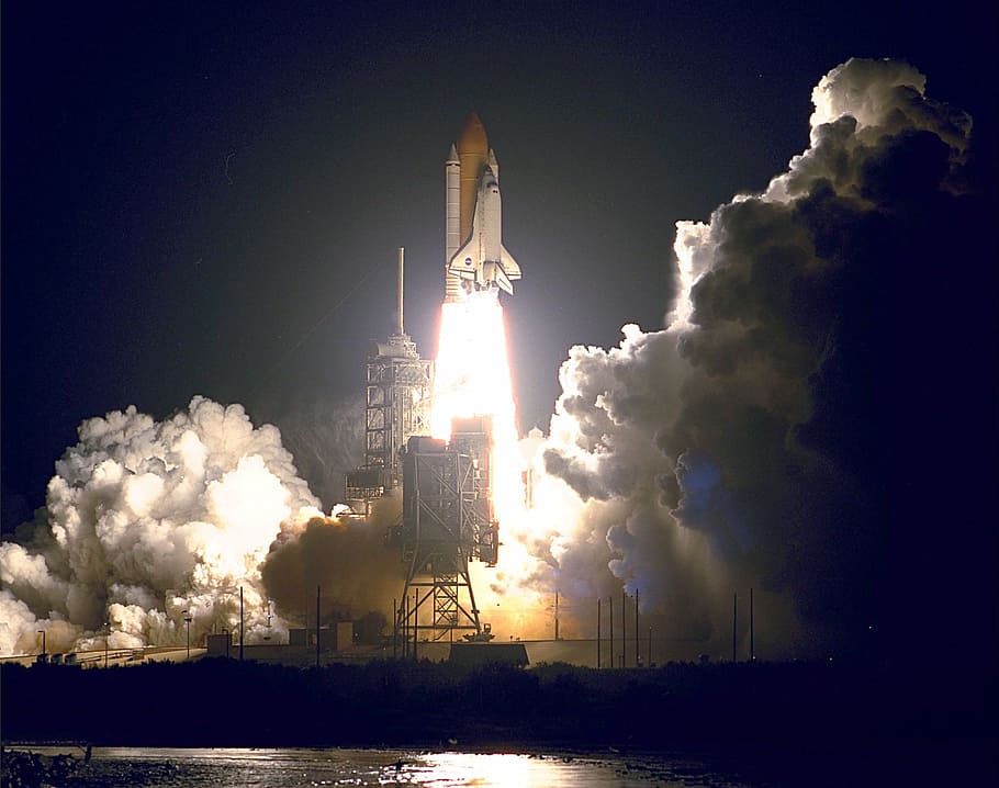 white space shuttle launching on platform during night time, space shuttle endeavour launch