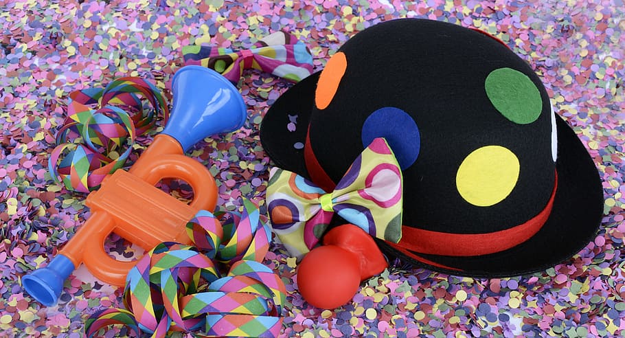 photo of black, red, and green bucket hat beside red clown nose HD wallpaper
