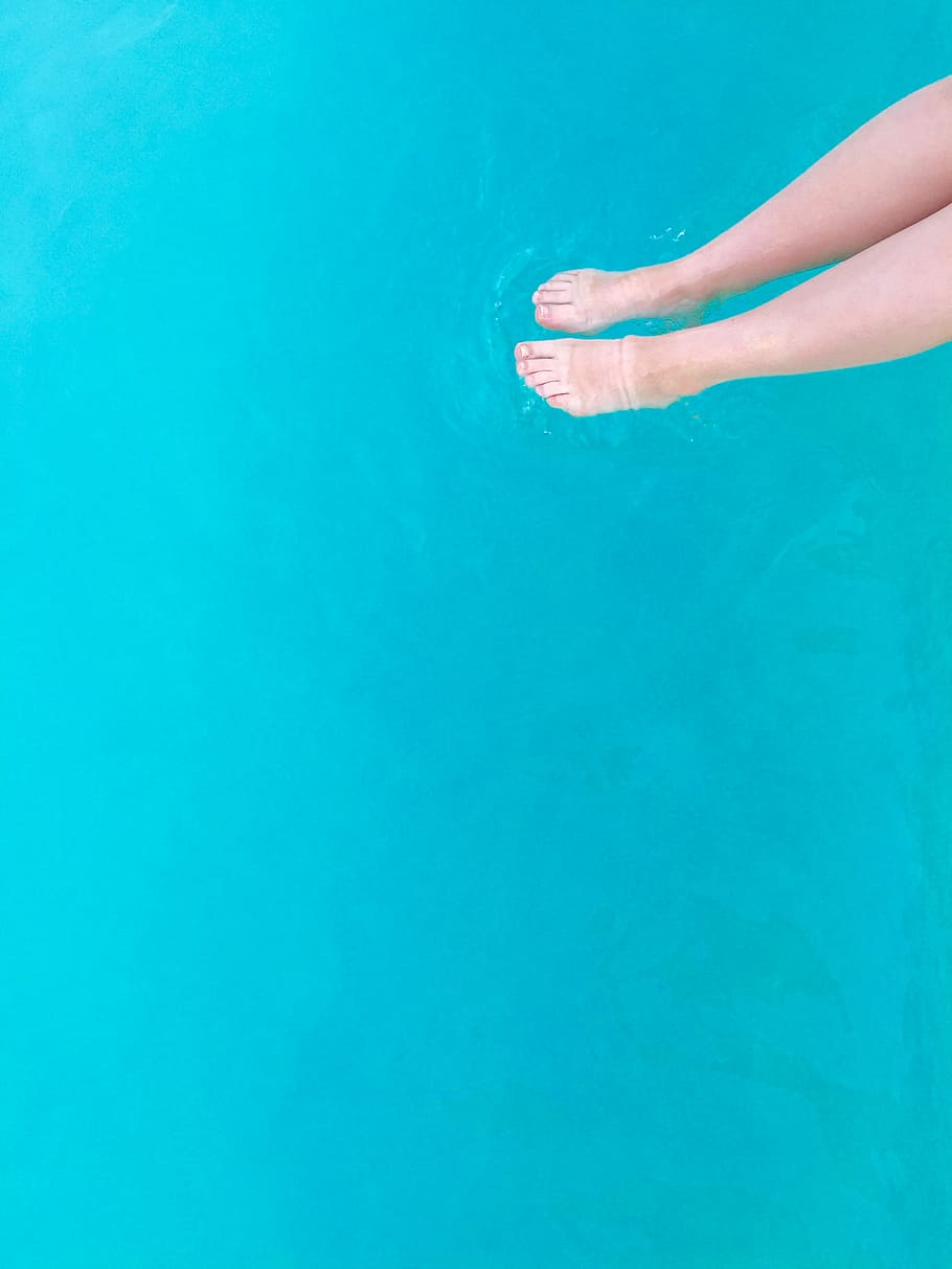 person's feet on body of water at daytime, person near body of water HD wallpaper