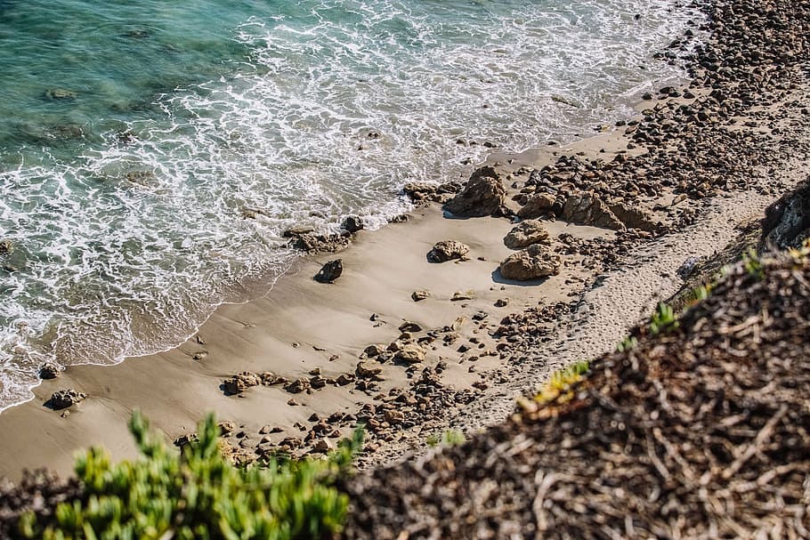landscape photography of body of water crashing on sand, beach HD wallpaper