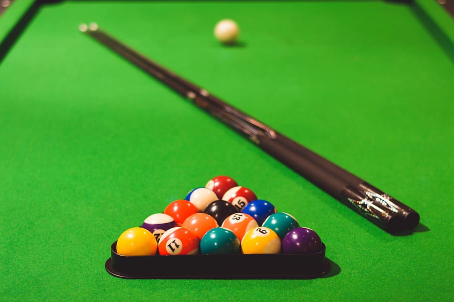 HD wallpaper: shallow focus photo of billiard cue ball set, pool balls and cue stick set on billiard table - Wallpaper Flare