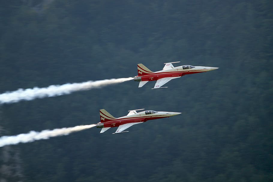 two red-and-white jet planes on air, two flying white jetplanes on air HD wallpaper