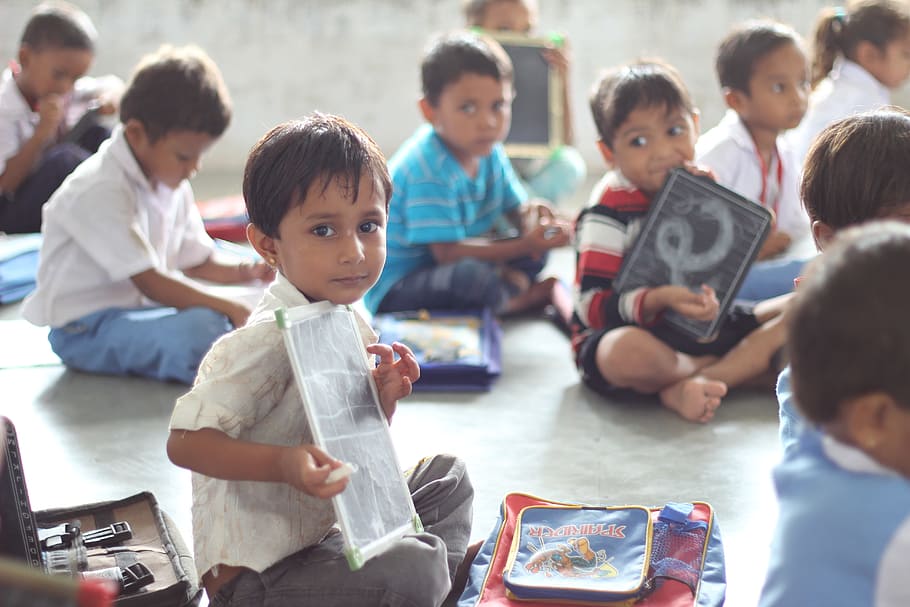 boy holding white paper, school, india, children, ahmedabad, infant
