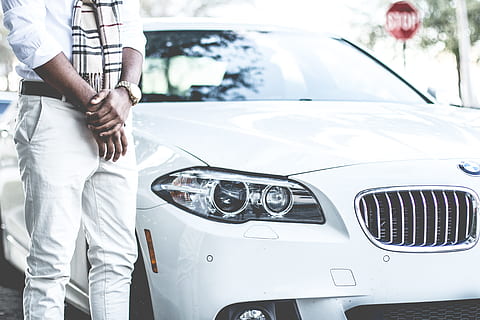 person standing beside the white BMW car, man standing beside white BMW car HD wallpaper
