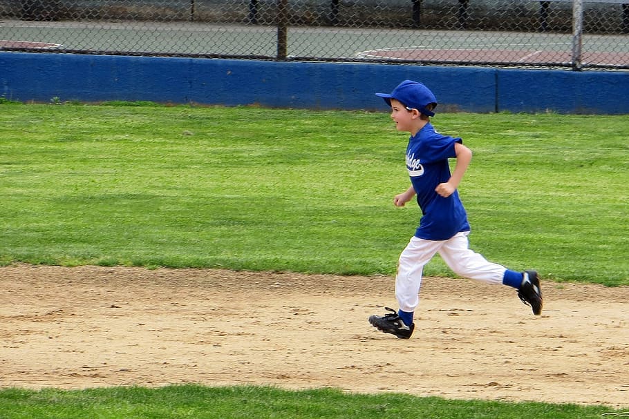 boy baseball player running on ballpark, little league, small