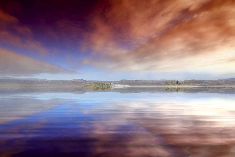 long angle photography of island under red clouds, glowing HD wallpaper