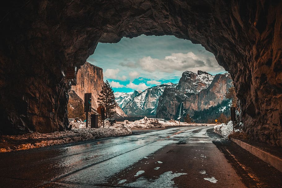 empty road tunnel leading to mountains, tunnel road with mountain covered with white snow during daytime view, HD wallpaper