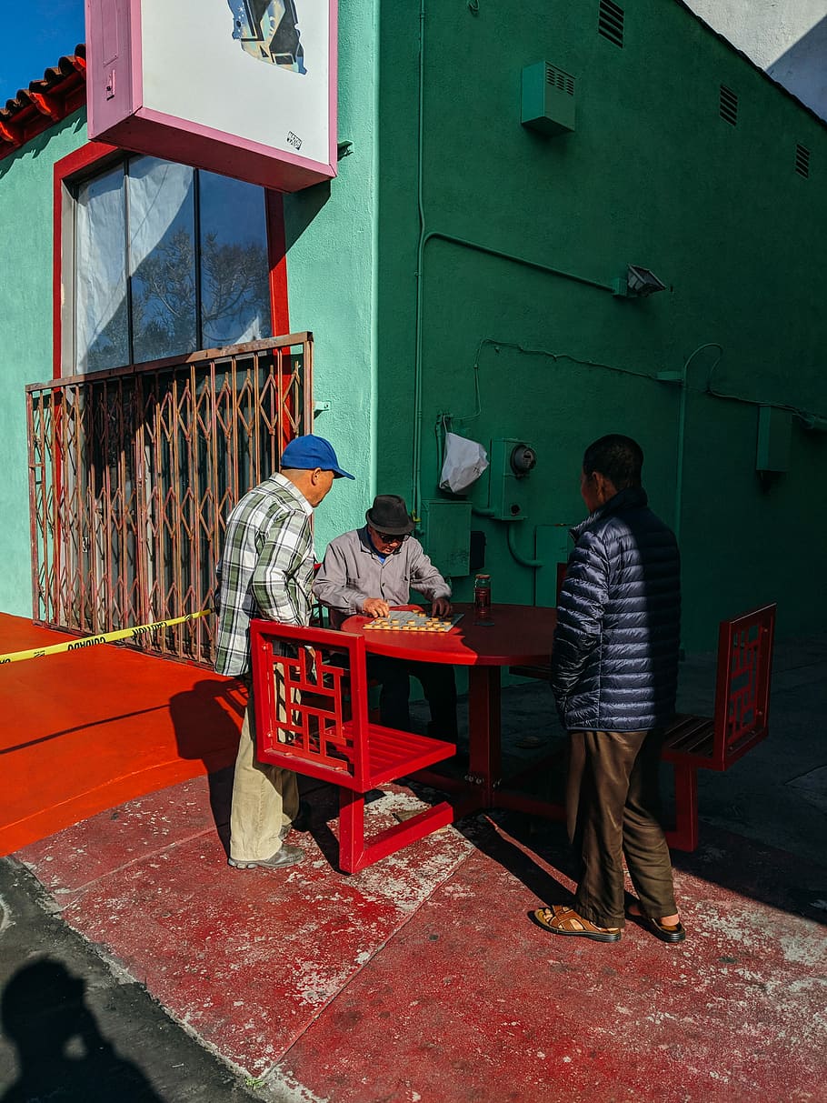 three man playing board games outdoor, man sitting while playing board game, HD wallpaper