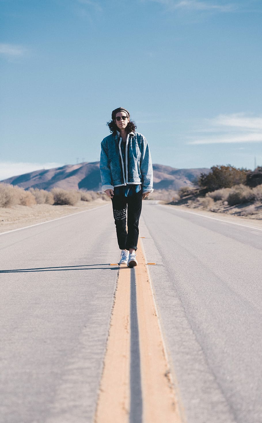 man standing on the middle of the road during day time, outdoors HD wallpaper