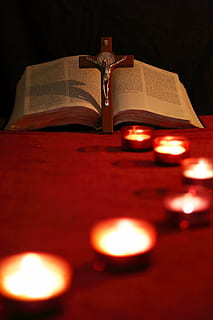 crucifix leaned on bible, candle, lead, path, cross, light HD wallpaper
