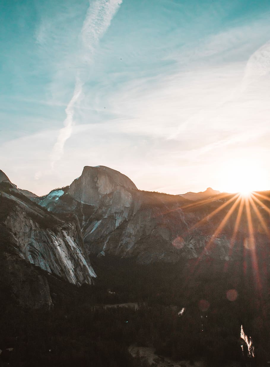 rock mountain, grey mountain during sunrise, forest, trees, sun flare HD wallpaper