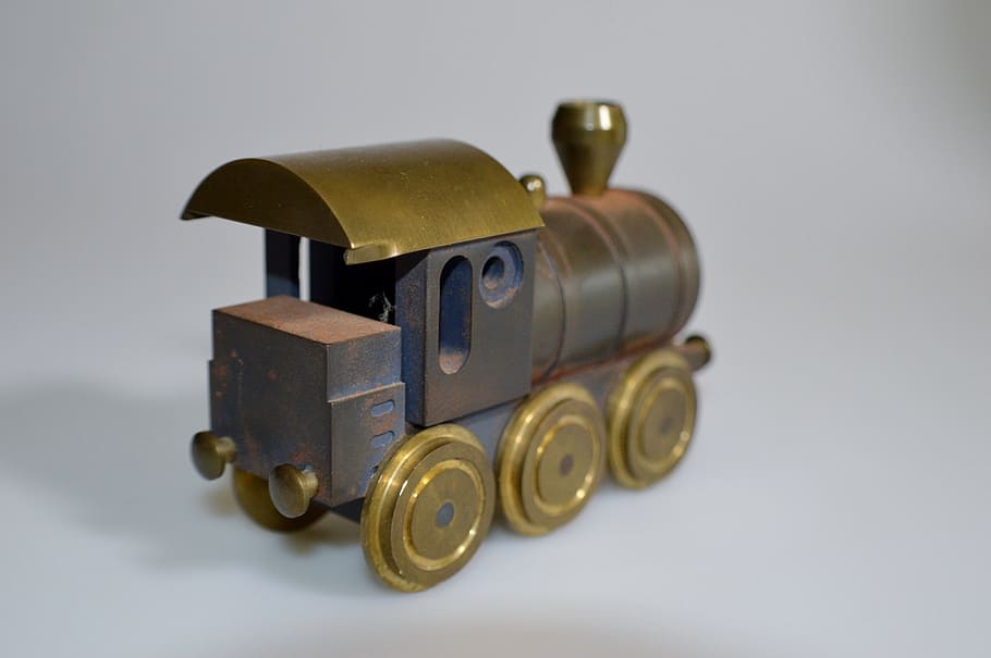locomotive, brass, iron, object, studio shot, indoors, white background