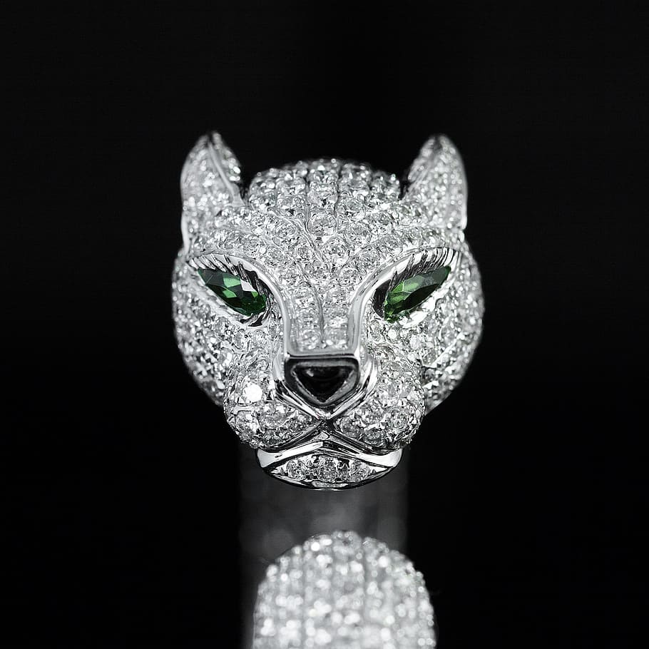 silver-colored clear gemstone encrusted cat pendant, cartier