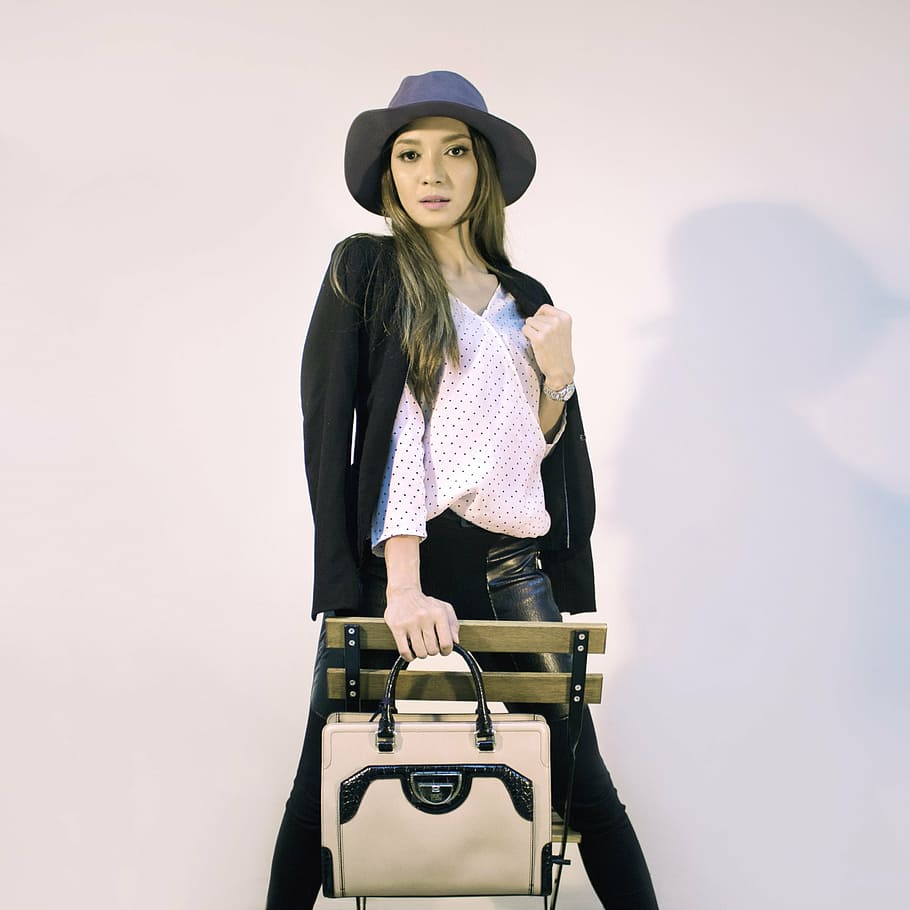 woman wearing black jacket posing, handbags, fashion, editorial