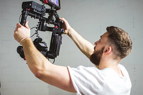 man holding camera stabilizer, people, guy, operator, video HD wallpaper