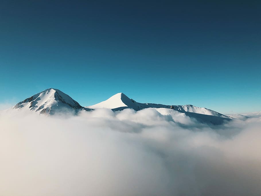 photo of mountain covered with fog, snow mountain covered with seaclouds HD wallpaper
