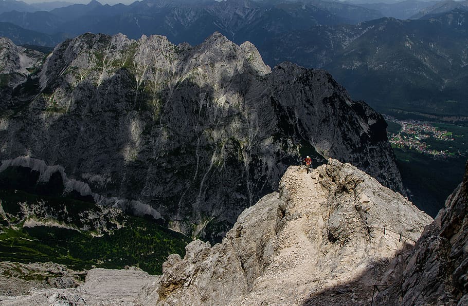 person standing in the peak of mountain range, photo of mountain during daytime HD wallpaper