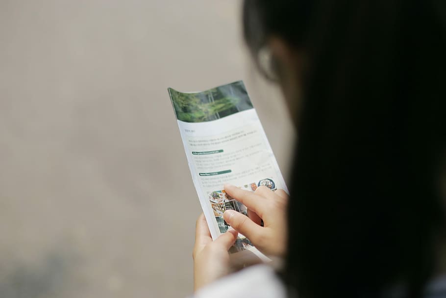 woman with black hair reading catalogue, Guidance, Browse, Explore HD wallpaper