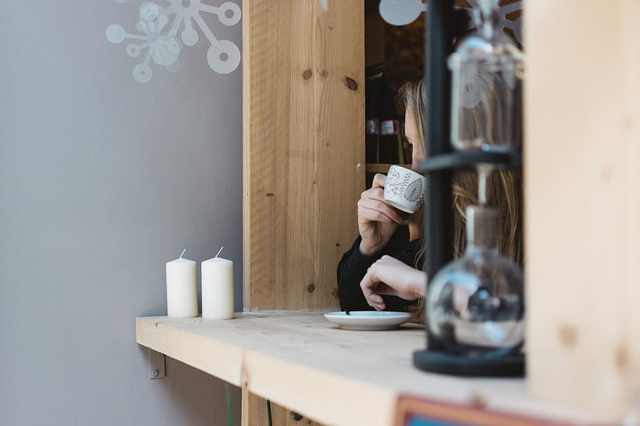 Girl drinking coffee at a window seat, café, hands, indoors HD wallpaper