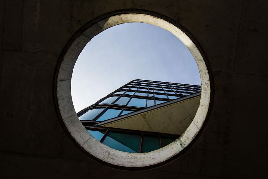 low angle photography of high-rise building, worm's-eye view photography of blue glass-panel building on hole HD wallpaper