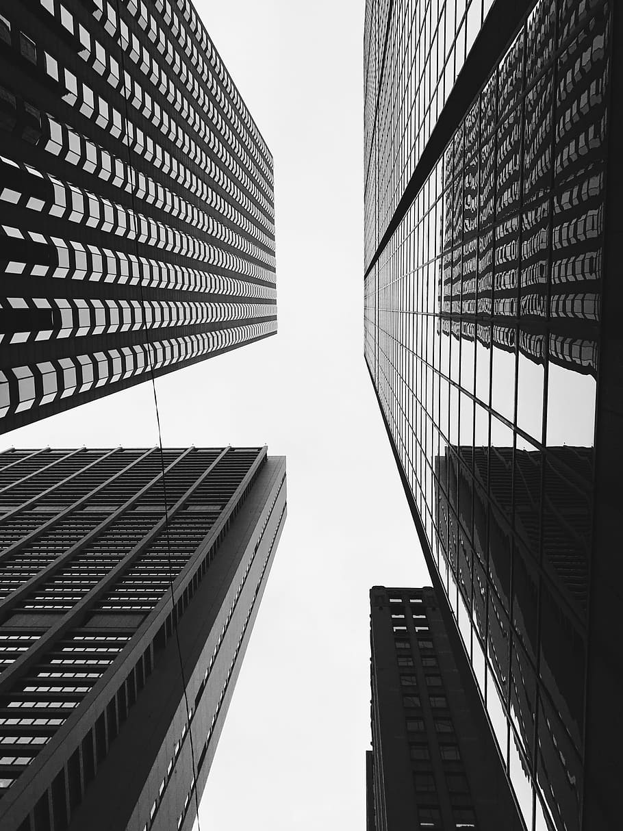 low-angle grayscale photo of high-rise building, low angle photography of high rise buildings at daytime HD wallpaper