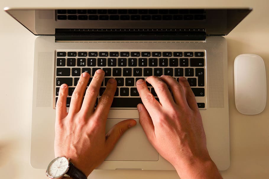 person using MacBook Pro with Apple Mighty Mouse, office, working HD wallpaper