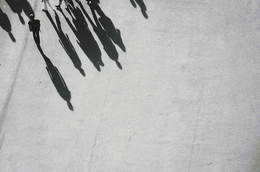 grayscale photography of shadow of people walking, group of people walking on gray pavement HD wallpaper