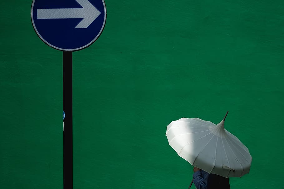 umbrella, green, wall, arrow, green color, day, nature, real people HD wallpaper