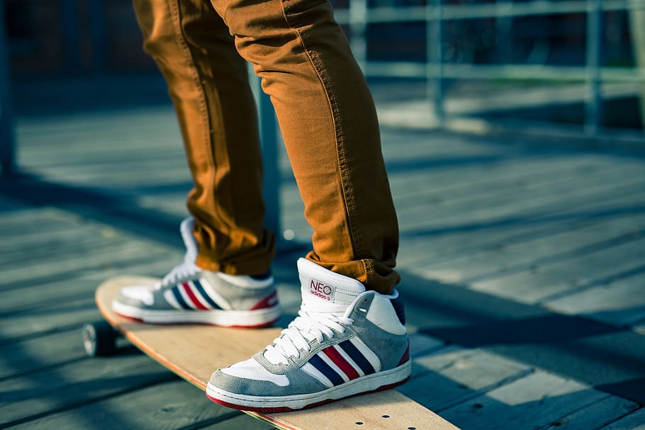 person wearing gray-white-and-red high-top sneakers on beige longboard, HD wallpaper