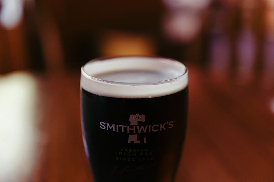 clear Smithwick's glass with coffee, Smithwick's glass tumbler HD wallpaper