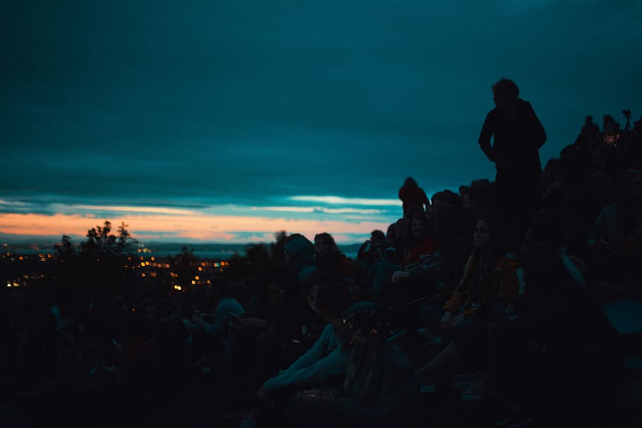 silhouette photo of people on top of the mountain, people sitting on cliff during dawn HD wallpaper
