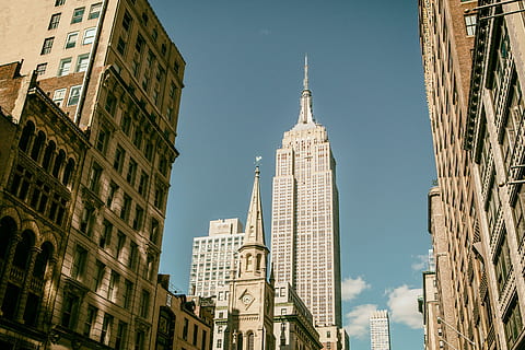 Street level shot capturing the Empire State Building in Manhattan, New York City HD wallpaper