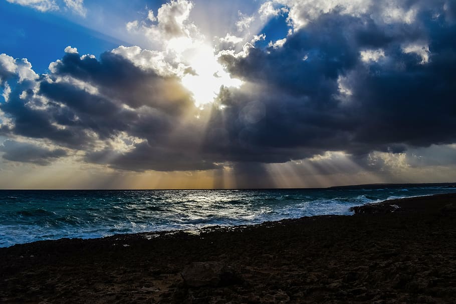 photography of calm sea under crepuscular rays, waves, storm HD wallpaper