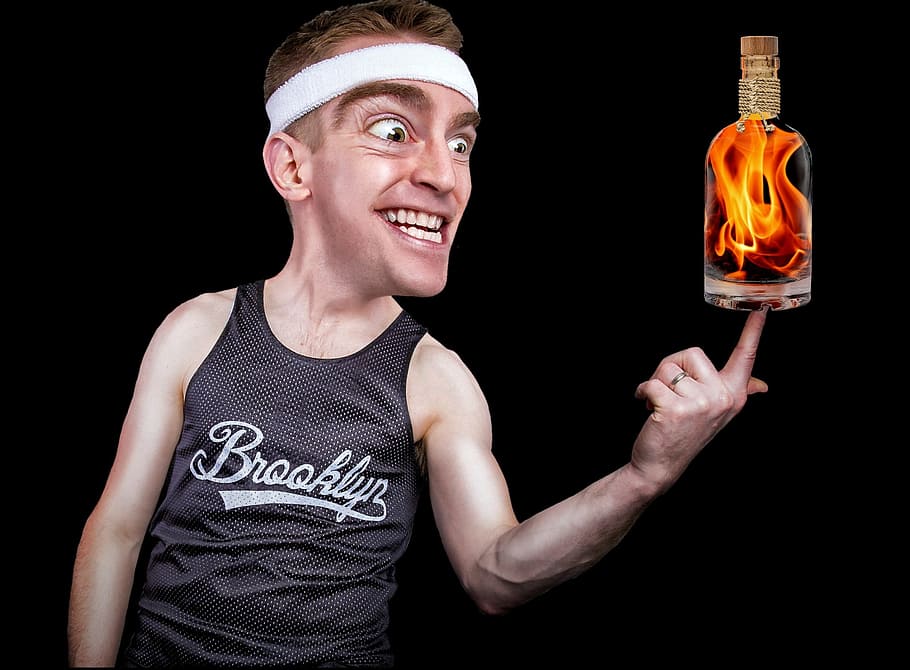 man holding flaming bottle sticker, crazy, fire water, balance HD wallpaper