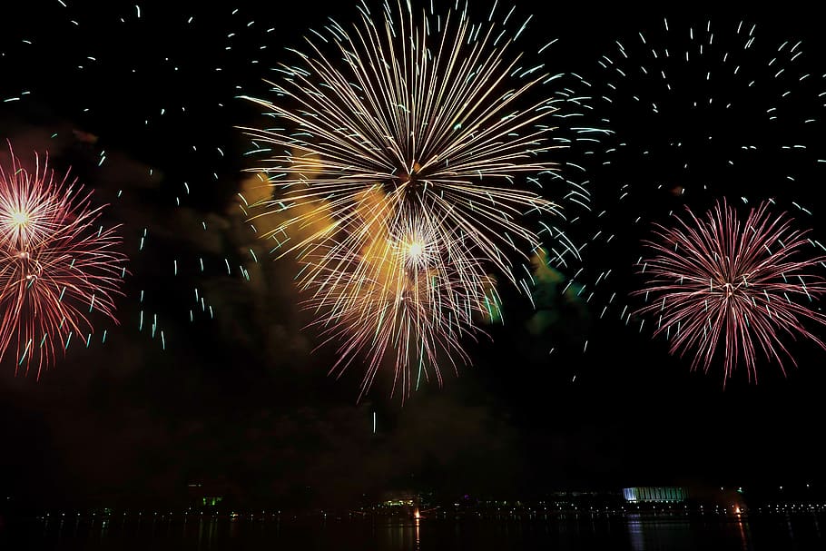yellow and pink fireworks display in sky, assorted-color fireworks display during night time HD wallpaper