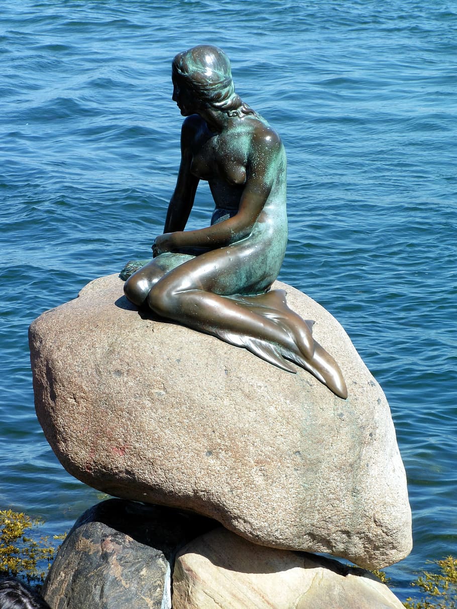 The Little Mermaid statue near body of water, denmark, tourist attraction