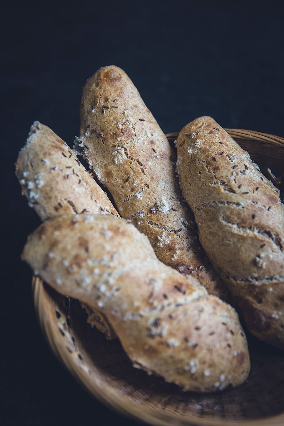 four leavened breads, four baked pastries on brown wicker basket HD wallpaper