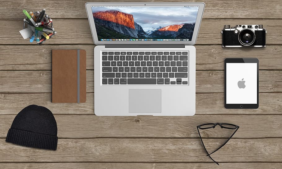 MacBook Air beside brown tablet computer case, laptop, desk top HD wallpaper