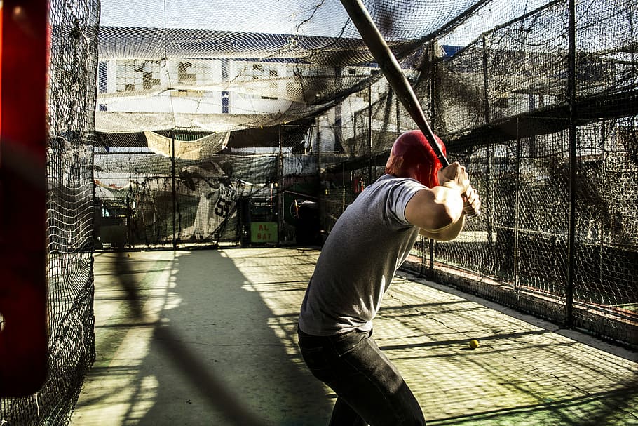 baseball, man holding baseball bat, helmet, ready, fence, sunlight HD wallpaper