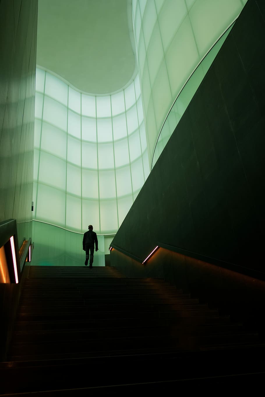man walking on stair inside building, person walking on stair in building HD wallpaper