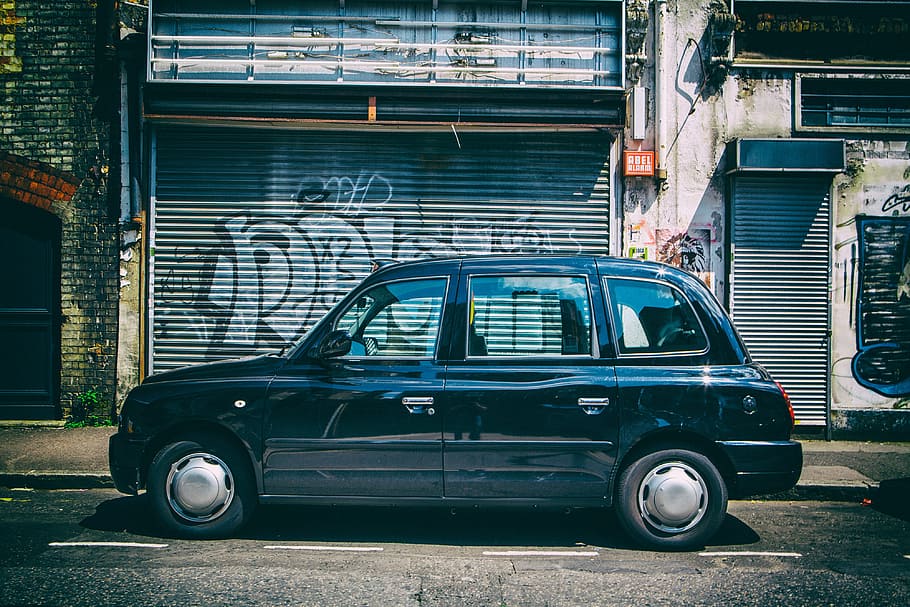 Wide-angle street shot of a black London taxi in East London, image captured with a Canon 5D DSLR, HD wallpaper
