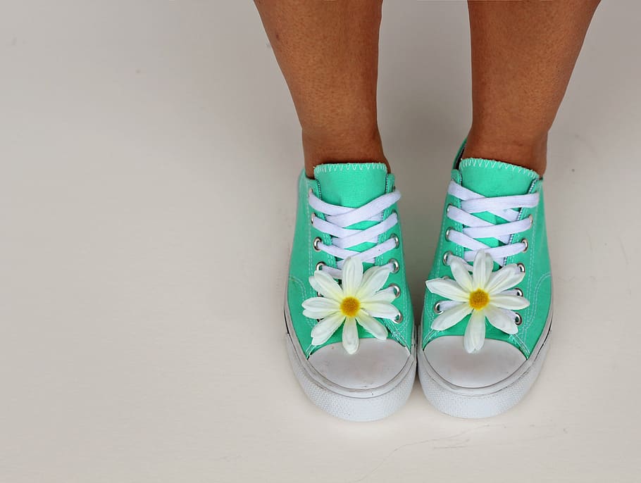 person wears green low-top shoes, spring, spring background, happy