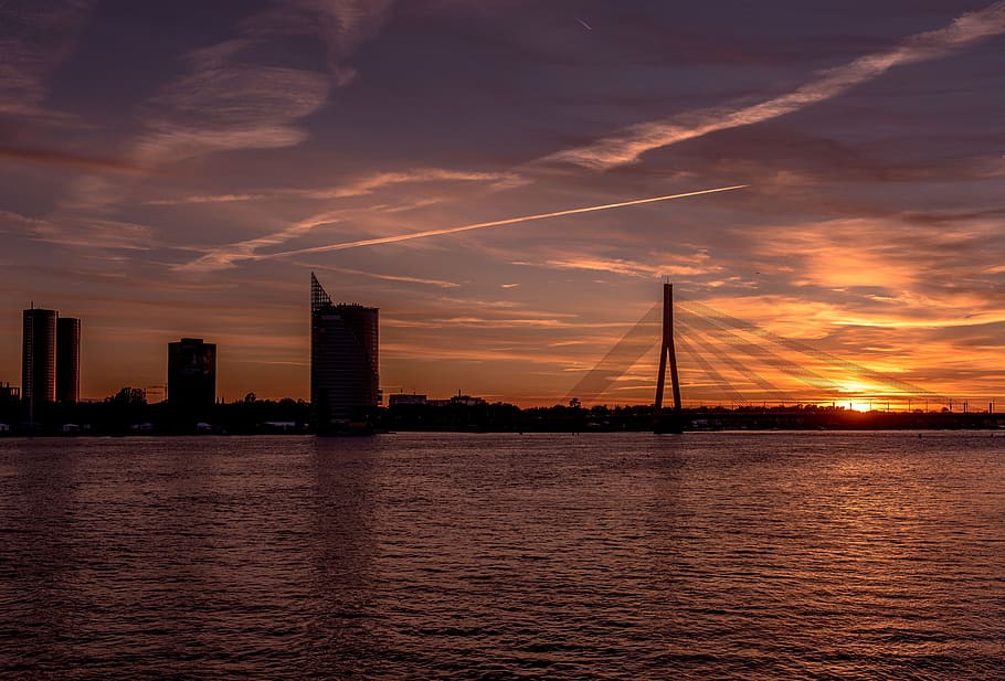 baltic states, riga, sunset, bridge, water, sky, architecture HD wallpaper